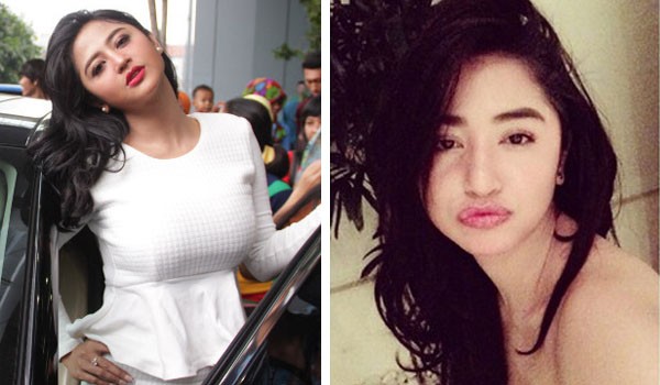 Dewi Perssik dipijit David Iztambul, rekan duetnya dalam video klip terbarunya berjudul â€˜Karena Kamuâ€™. Foto: Manajemen Iztambul Band for JPNN.com