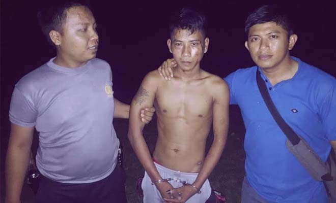 Pelaku pembunuhan sadis ditebo, Muhaimin Alias Andre (20) saat berhasil ditangkap polisi.