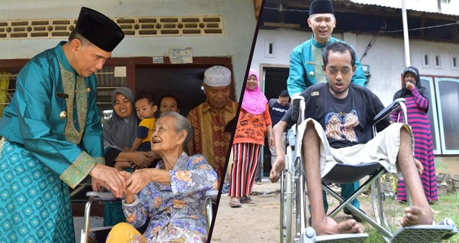 Walikota Jambi, Fasha saat memberikan bantuan Kursi Roda.