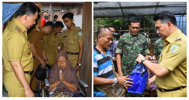 Walikota Jambi, Sy Fasha memberikan kursi roda kepada warga dan memberikan bantuan untuk korban kebakaran di Kota Jambi.