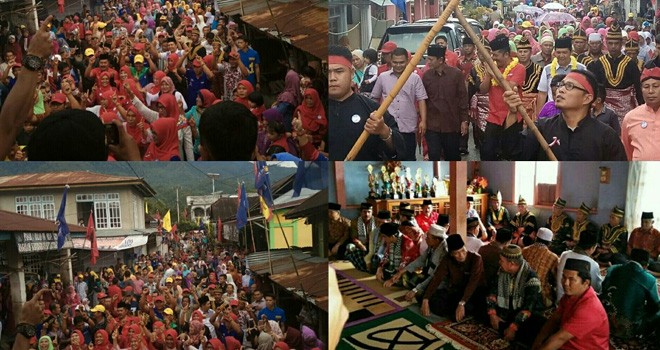 Warga Pulau Tengah Arak Monadi-Edison Keliling Kampung.