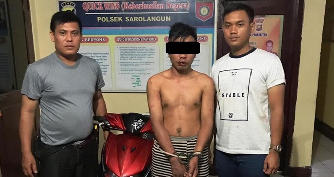 salah satu pelaku begal di Jalinsum Sarolangun saat diamankan pihak kepolisian, Minggu (20/9).