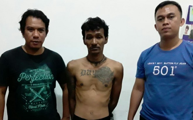 Tersangka saat di amankan Polisi. Foto : Ist
