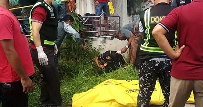 Mayat yang ditemukan di selokan pembuangan air, Minggu (21/7/2019).