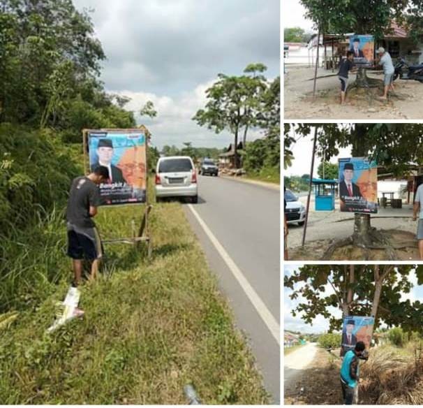 Relawan memasang baleho Sy Fasha di Singkut