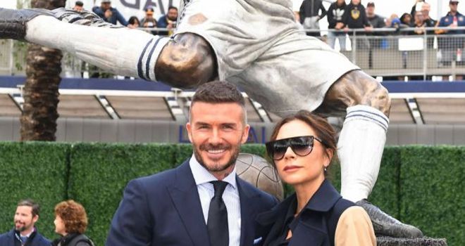 David Beckham bersama sang istri Victoria.
 