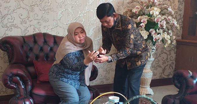 Masnah Busro dan  Syafril Nursal