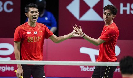 Indonesia's Fajar Alfian and Muhammas Rian Ardianto (R) react after winning a point during their men's double match against China's He Ji Ting and Zhou Hao Dong (Both unseen) during the Thomas Cup men's team final between China and Indonesia in Aarhus, Denmark, on October 17, 2021. 